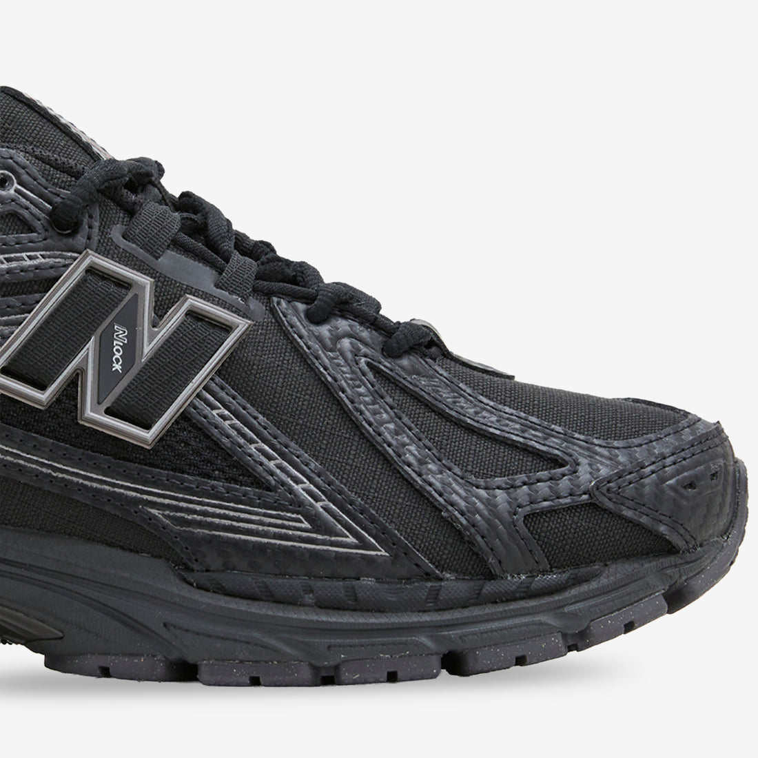 1906R Black | Silver Metallic Footwear