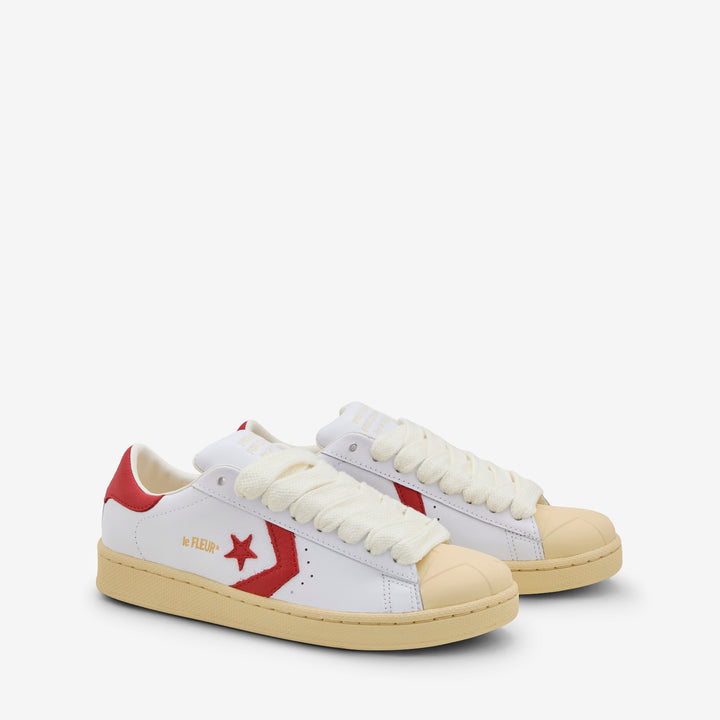 1908 by Tyler, The Creator Pro Leather Low White | Molten Lava | Banana Crepe Front